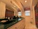 Bathroom featuring a double vanity with a unique green countertop and ample lighting, creating a spacious feel at 1224 Island Creek Dr, Troy, NC 27371