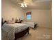 Charming bedroom with twin beds, each adorned with plush bedding, set against a backdrop of neutral walls at 1224 Island Creek Dr, Troy, NC 27371