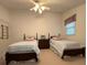 Bright bedroom showcasing two beds, classic wooden furniture, and soothing decor for a restful ambiance at 1224 Island Creek Dr, Troy, NC 27371