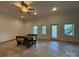 Bright dining area with large windows and an access door at 1224 Island Creek Dr, Troy, NC 27371