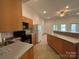 Updated kitchen features modern appliances, a breakfast bar, and plenty of natural light at 1224 Island Creek Dr, Troy, NC 27371
