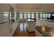 This kitchen is equipped with white cabinetry, a kitchen island, and hardwood floors throughout at 1224 Island Creek Dr, Troy, NC 27371