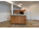 A minimalist kitchen that features modern cabinets, stainless appliances, and a functional island at 1224 Island Creek Dr, Troy, NC 27371