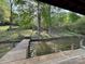 Exterior shot of a wood boat dock overlooking calm water and trees at 1224 Island Creek Dr, Troy, NC 27371