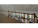 Open-concept living area with hardwood floors, a dining area, and a railing, showcasing the home's spacious design at 1224 Island Creek Dr, Troy, NC 27371