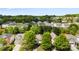 Aerial view of a neighborhood surrounded by green trees with many single-Gathering homes at 12319 Cumberland Cove Dr, Charlotte, NC 28273