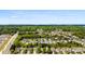 Aerial view features a sprawling residential area with houses nestled among a dense forest, offering a serene setting at 12319 Cumberland Cove Dr, Charlotte, NC 28273