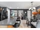 Open kitchen design with island seating, stainless steel appliances, and a view to the living area at 12319 Cumberland Cove Dr, Charlotte, NC 28273