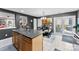 Eat-in kitchen featuring an island with seating, stainless appliances and access to the patio at 12319 Cumberland Cove Dr, Charlotte, NC 28273