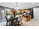 Bright kitchen featuring stainless appliances, updated cabinetry, and a cozy dining area at 12319 Cumberland Cove Dr, Charlotte, NC 28273