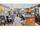 Eat-in kitchen with stainless appliances, a large island, and a dining table at 12319 Cumberland Cove Dr, Charlotte, NC 28273