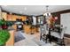 Open kitchen featuring stainless steel appliances, island seating, and adjacent dining area at 12319 Cumberland Cove Dr, Charlotte, NC 28273