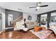 Spacious living room with hardwood floors, staircase, and a view of the dining area at 12319 Cumberland Cove Dr, Charlotte, NC 28273