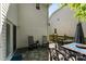 Covered patio with tiled floor and a dining set perfect for outdoor relaxation at 12319 Cumberland Cove Dr, Charlotte, NC 28273