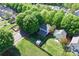 Aerial view of a home with a fenced backyard, mature trees, and a storage shed at 13206 Meadowmere Rd, Huntersville, NC 28078