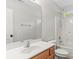 This bathroom features a single sink vanity and a shower over tub at 13206 Meadowmere Rd, Huntersville, NC 28078
