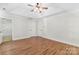 Bright bedroom with a tray ceiling, ceiling fan, and a walk-in closet at 13206 Meadowmere Rd, Huntersville, NC 28078