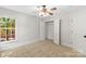 A cozy bedroom includes carpet, a window with a view, and access to a closet at 13206 Meadowmere Rd, Huntersville, NC 28078