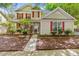 Charming two-story home with red shutters, stone accents, and a well-manicured front yard at 13206 Meadowmere Rd, Huntersville, NC 28078