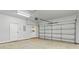 Spacious garage with an automatic door and extra storage space on the side at 13206 Meadowmere Rd, Huntersville, NC 28078