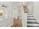 Bright entryway with stairs and a view through to other living areas of the home at 13206 Meadowmere Rd, Huntersville, NC 28078