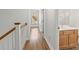 Second floor hallway view with a half bath and natural light at 13206 Meadowmere Rd, Huntersville, NC 28078
