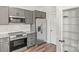 Efficient kitchen featuring stainless steel appliances and convenient pantry space at 13206 Meadowmere Rd, Huntersville, NC 28078