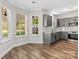 Modern kitchen with stainless steel appliances, subway tile backsplash, and gray cabinets at 13206 Meadowmere Rd, Huntersville, NC 28078