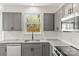Well-equipped kitchen with gray cabinetry and stainless appliances at 13206 Meadowmere Rd, Huntersville, NC 28078