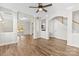 Spacious living area featuring hardwood floors, staircase, and backyard access at 13206 Meadowmere Rd, Huntersville, NC 28078