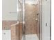 A bathroom shower features clear glass, tiled walls, and modern fixtures at 13206 Meadowmere Rd, Huntersville, NC 28078