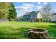 A sprawling backyard with lush green grass and a charming patio, perfect for outdoor enjoyment at 15407 Saxon Trace Ct, Huntersville, NC 28078