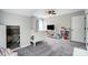 Bright bedroom with a cozy bed, desk, and ceiling fan, ideal for relaxation at 15407 Saxon Trace Ct, Huntersville, NC 28078