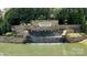 Beautiful stone entrance sign for Northstone Country Club with a cascading waterfall feature at 15407 Saxon Trace Ct, Huntersville, NC 28078