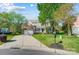 Inviting brick home with a spacious front yard, long driveway, and classic covered porch at 15407 Saxon Trace Ct, Huntersville, NC 28078