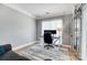 Bright home office with modern desk, natural light, and neutral decor is ideal for remote work and study at 15407 Saxon Trace Ct, Huntersville, NC 28078