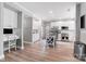 Bright kitchen featuring white cabinets, stainless steel appliances, and a center island with barstool seating at 15407 Saxon Trace Ct, Huntersville, NC 28078