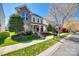 Inviting two-story home featuring manicured lawn and landscaping in a suburban setting at 15613 Troubadour Ln, Huntersville, NC 28078