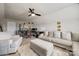 Spacious living room with a large sectional, desk area, and neutral decor provides a versatile and inviting living space at 15613 Troubadour Ln, Huntersville, NC 28078