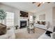 Cozy living room with fireplace, large windows, plush carpeting, neutral paint and lots of natural light at 15613 Troubadour Ln, Huntersville, NC 28078