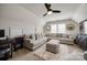 Comfortable living room featuring a large sectional sofa, plush rug, and stylish decor for a cozy and inviting atmosphere at 15613 Troubadour Ln, Huntersville, NC 28078