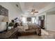 Spacious main bedroom features tray ceiling, ornate furnishings, and ample natural light for an elegant and relaxing atmosphere at 15613 Troubadour Ln, Huntersville, NC 28078