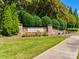 Stone sign for Gilead Ridge neighborhood entry with landscaped greenery and flowers against blue sky at 15613 Troubadour Ln, Huntersville, NC 28078