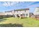 Residential backyard featuring a patio, play set, and a well-maintained lawn at 17546 Westmill Ln, Charlotte, NC 28277