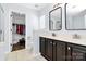 A bathroom with dual sinks and a walk-in closet at 17546 Westmill Ln, Charlotte, NC 28277
