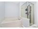 Bathroom boasting a soaking tub and shower enclosure with glass doors at 17546 Westmill Ln, Charlotte, NC 28277