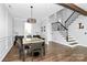 Bright dining room with dark wood floors, large window, and stylish light fixture at 17546 Westmill Ln, Charlotte, NC 28277