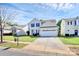 Traditional house with two car garage, front yard, and blue shutters at 17546 Westmill Ln, Charlotte, NC 28277