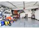 Spacious garage with ample storage space and work area, perfect for projects and hobbies at 17546 Westmill Ln, Charlotte, NC 28277