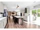 Bright kitchen with an island, stainless steel appliances, and an open view of the living area at 17546 Westmill Ln, Charlotte, NC 28277